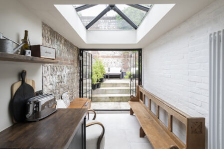 The kitchen has huge Crittall doors that open to the garden.