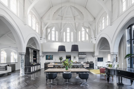 The central living space, with its high ceilings and striking archways